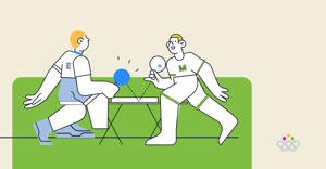 Manager and employee playing ping pong